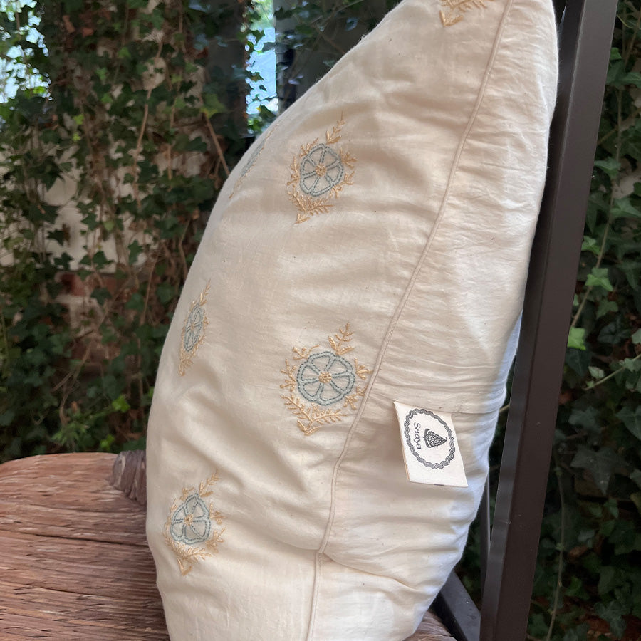 Bela Chikankari cushion cover with fine stitched motifs on handloom muslin.