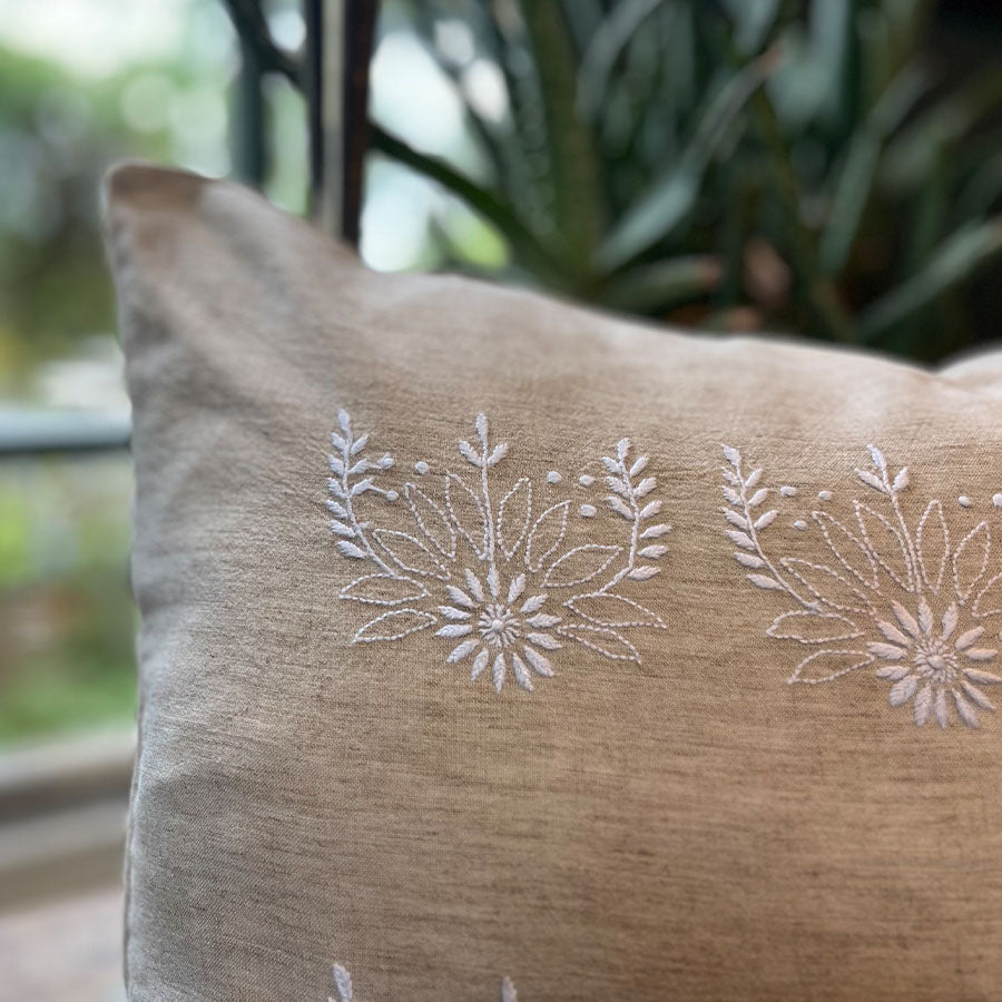 Close-up of Blossom Chikankari cushion cover with white hand embroidery