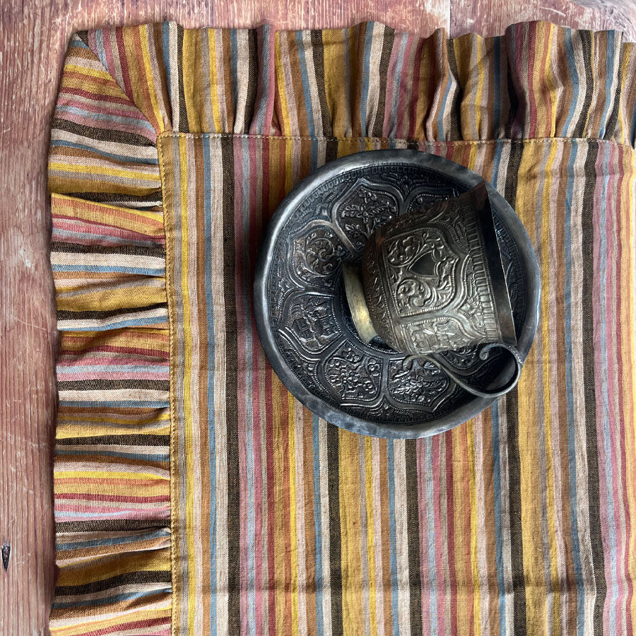 Mustard yellow stripped placemats with ruffled edges
