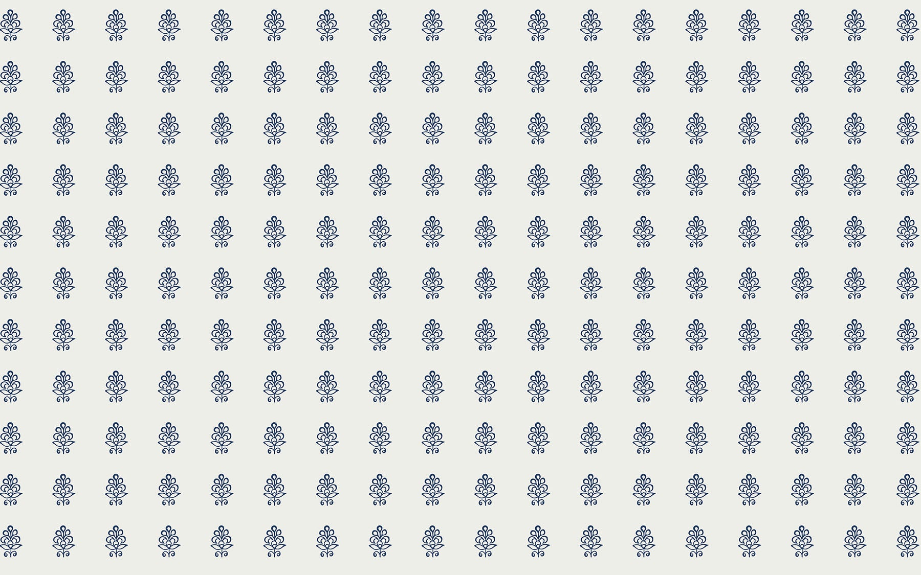 Pattern of small blue block prints on a white background