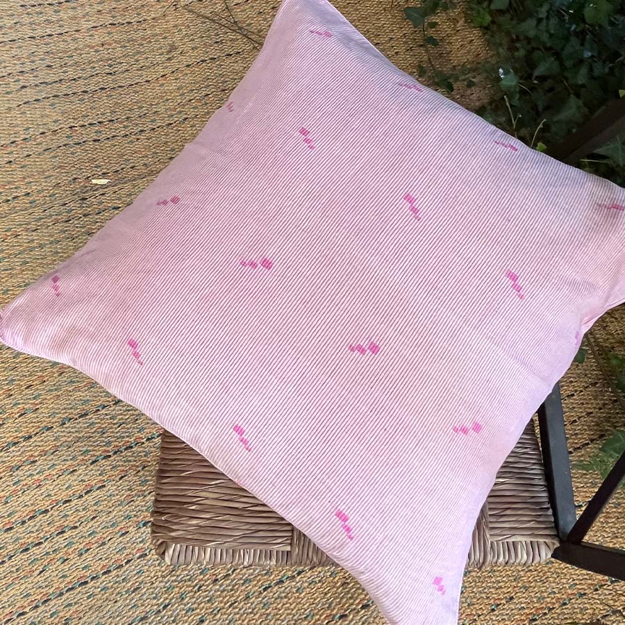 Pink Jamdani cushion cover with a subtle handwoven motif.