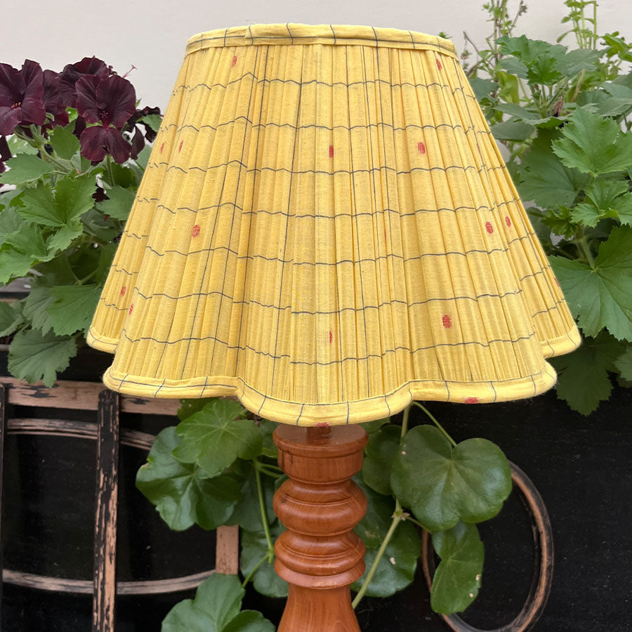 Warm yellow Jamdani lampshade with handwoven red motifs and scalloped edges