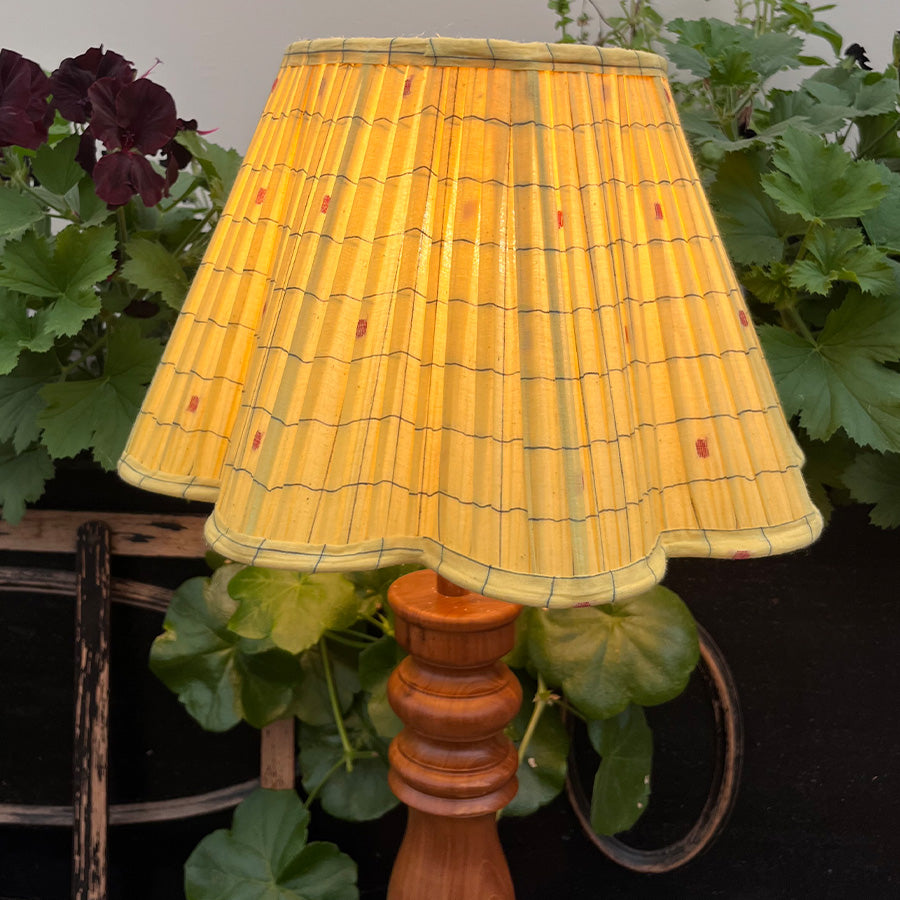 Warm yellow Jamdani lampshade with handwoven red motifs and scalloped edges